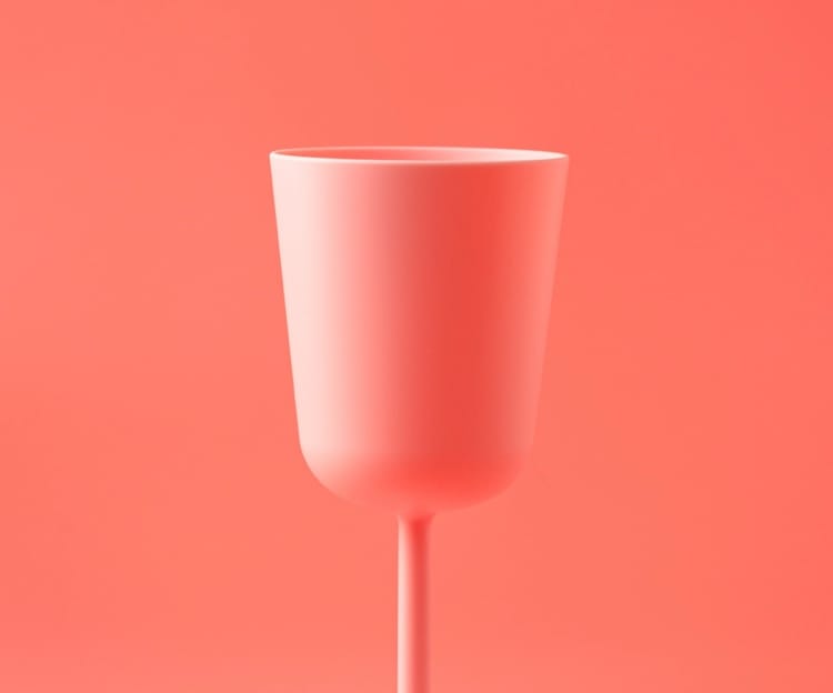 pink plastic cup with pink background